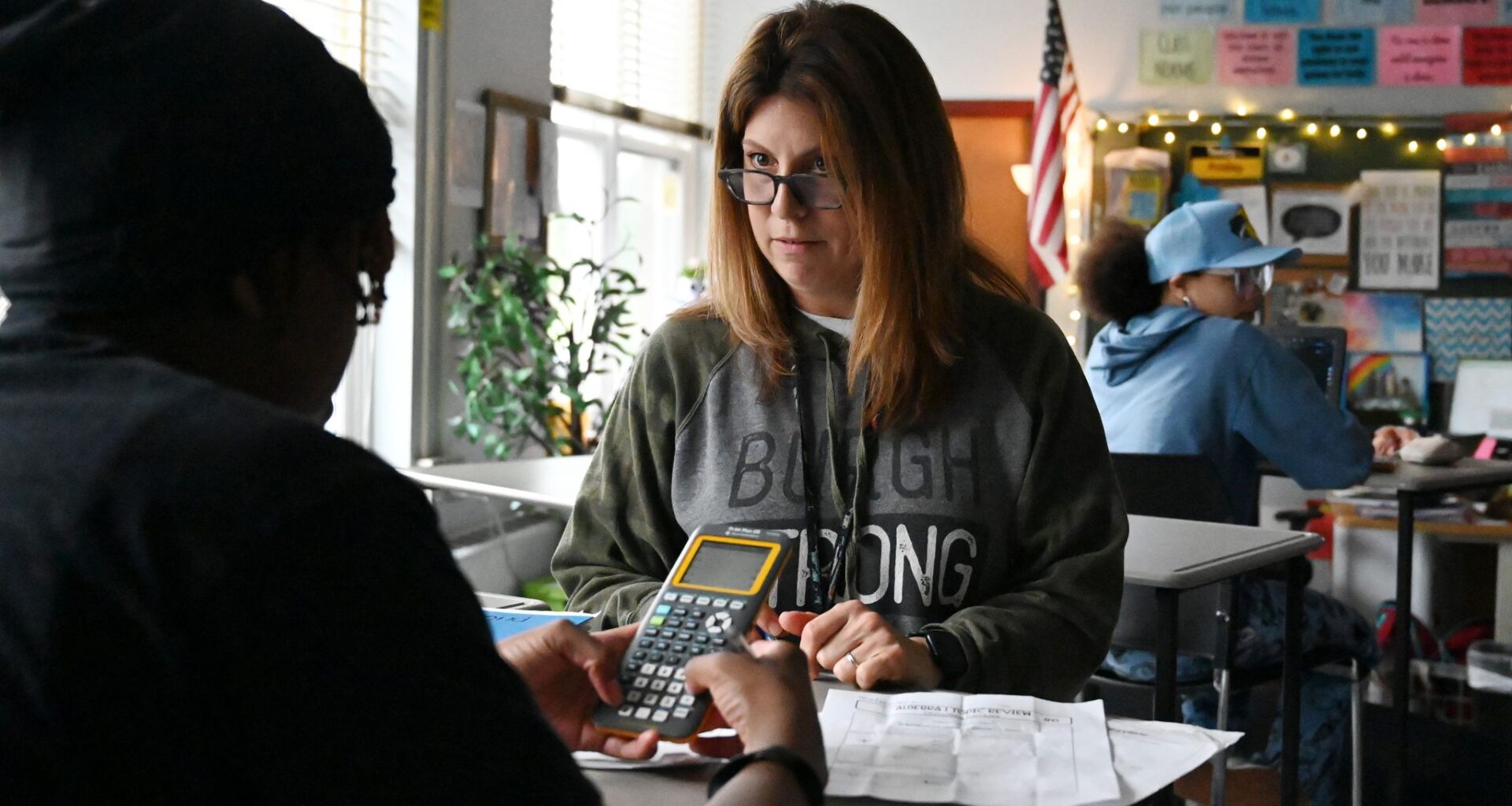 Lansingburgh High School math teacher Regina Felio helps a student prepare for their upcoming Algebra I Regents exam on Friday at Lansingburgh High School in Troy. Lansingburgh is among the local school districts whose students are overperforming in Algebra I exams, compared to other high need school districts. Its low teacher turnover is having an impact, data shows.