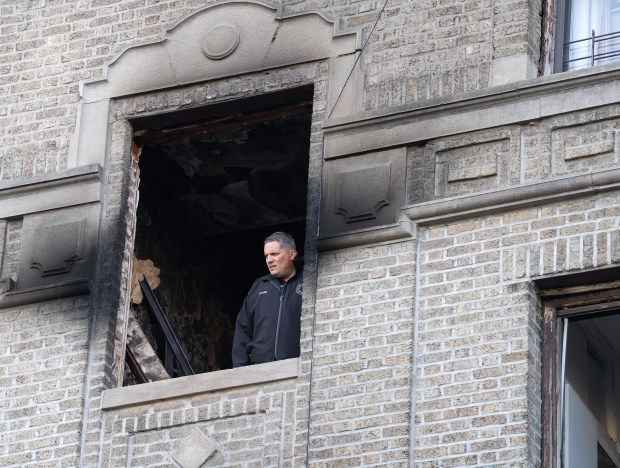 A FDNY investigator is pictured inside an apartment building on Bainbridge Ave. in the Bronx after a fatal fire on Monday, May 11, 2026. (Barry Williams/ New York Daily News)