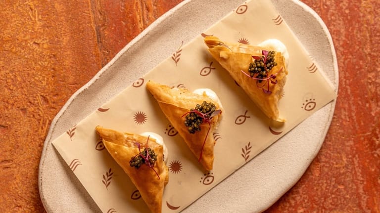 The tiropitakia, a savory Greek cheese pastry, at Selene, the...
