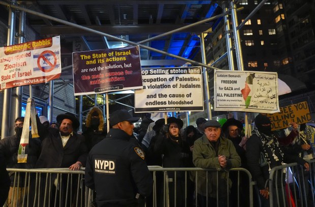 Pro-Palestinian protesters gather at a 'No Settlers on Stolen Land' protest against a settler-recruitment event at the Park East Synagogue in Manhattan on Wednesday, Nov. 19, 2025, in New York City. (Photo by Selçuk Acar/Anadolu via Getty Images)