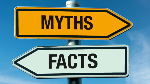 Signpost with arrows labeled myths and facts
