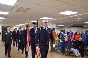 FDNY Ceremonial Unit leads in the Legionnaires of Post 1836 inside the hall to start the ceremony.