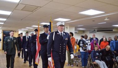 FDNY Ceremonial Unit leads in the Legionnaires of Post 1836 inside the hall to start the cere­mony.