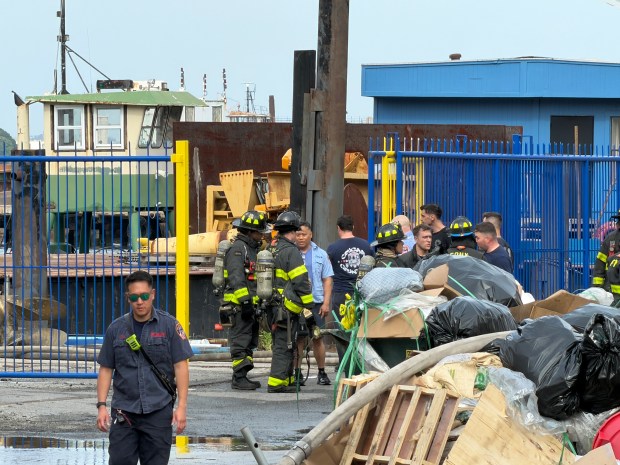 Emergency responders are pictured after an explosion and fire at a shipyard on Richmond Terrace in Staten Island on Friday.