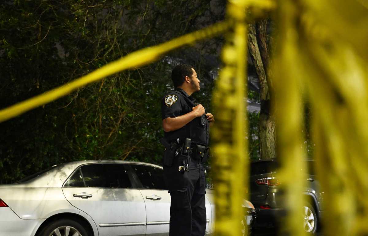 police officer at scene of murder in Bronx