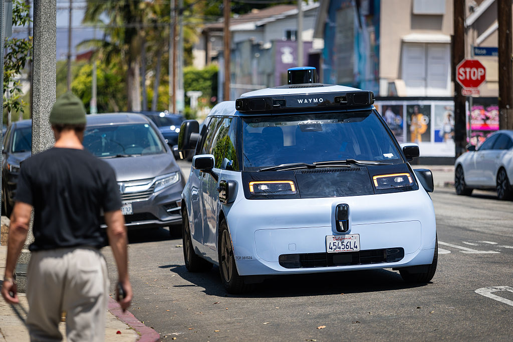 Waymo's new autonomous vehicle, called the Ojai, drives in Venice Beach, California, on May 27. The all-electric vehicle is expected to begin limited rides with select customers in Los Angeles, San Francisco and Phoenix in the coming weeks. 