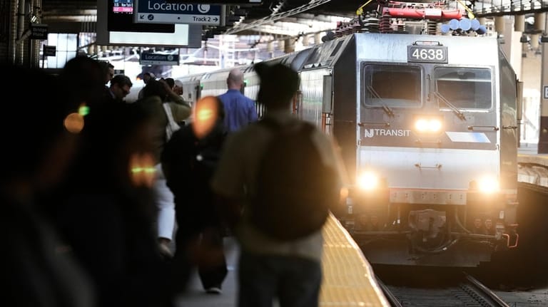 A NJ Transit train leaves Newark Penn Station in Newark,...
