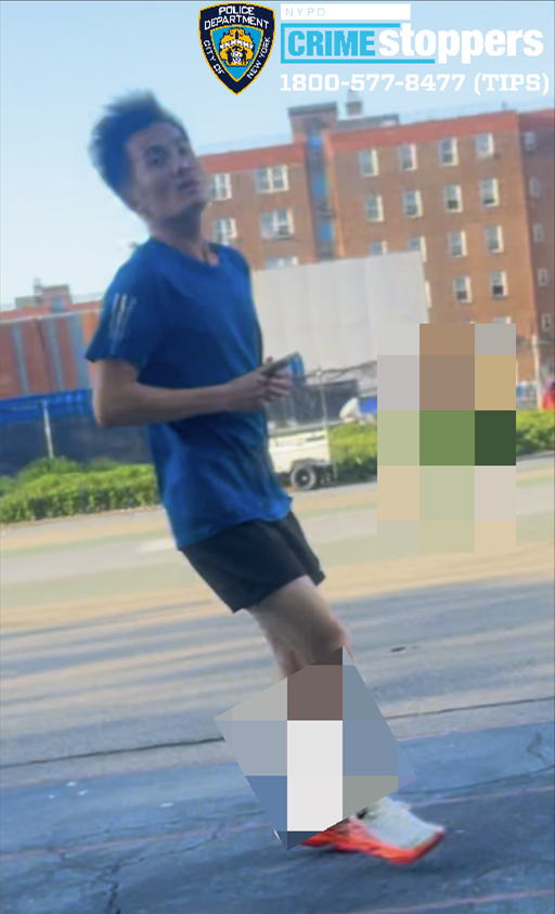 A cropped image of an individual sought by the NYPD, wearing a blue shirt and black shorts, walking on a street.
