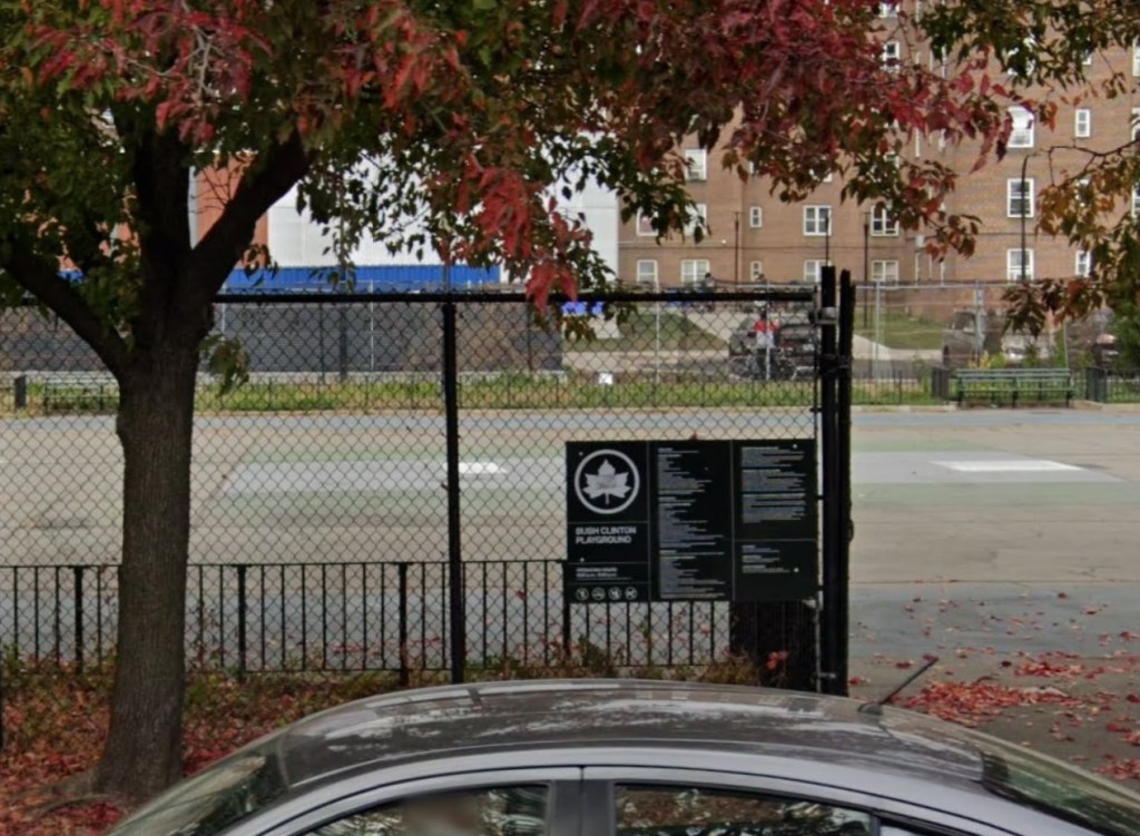 Bush Clinton Playground with a car in the foreground.