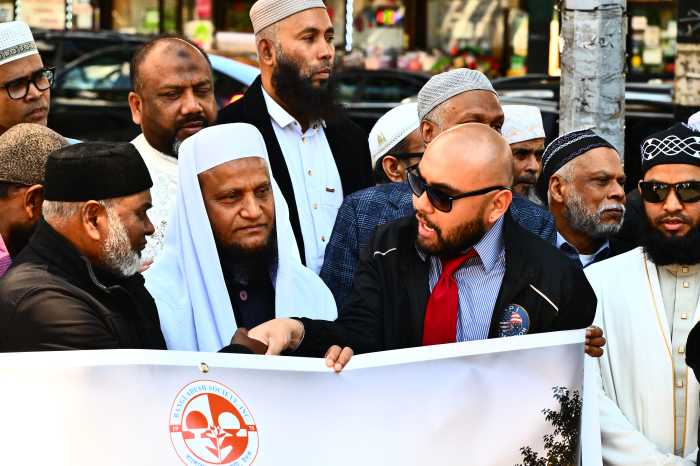 Jannath's father Helal Amhed (center) with Assembly Member Steven Raga (right). Photo by Ramy Mahmoud.