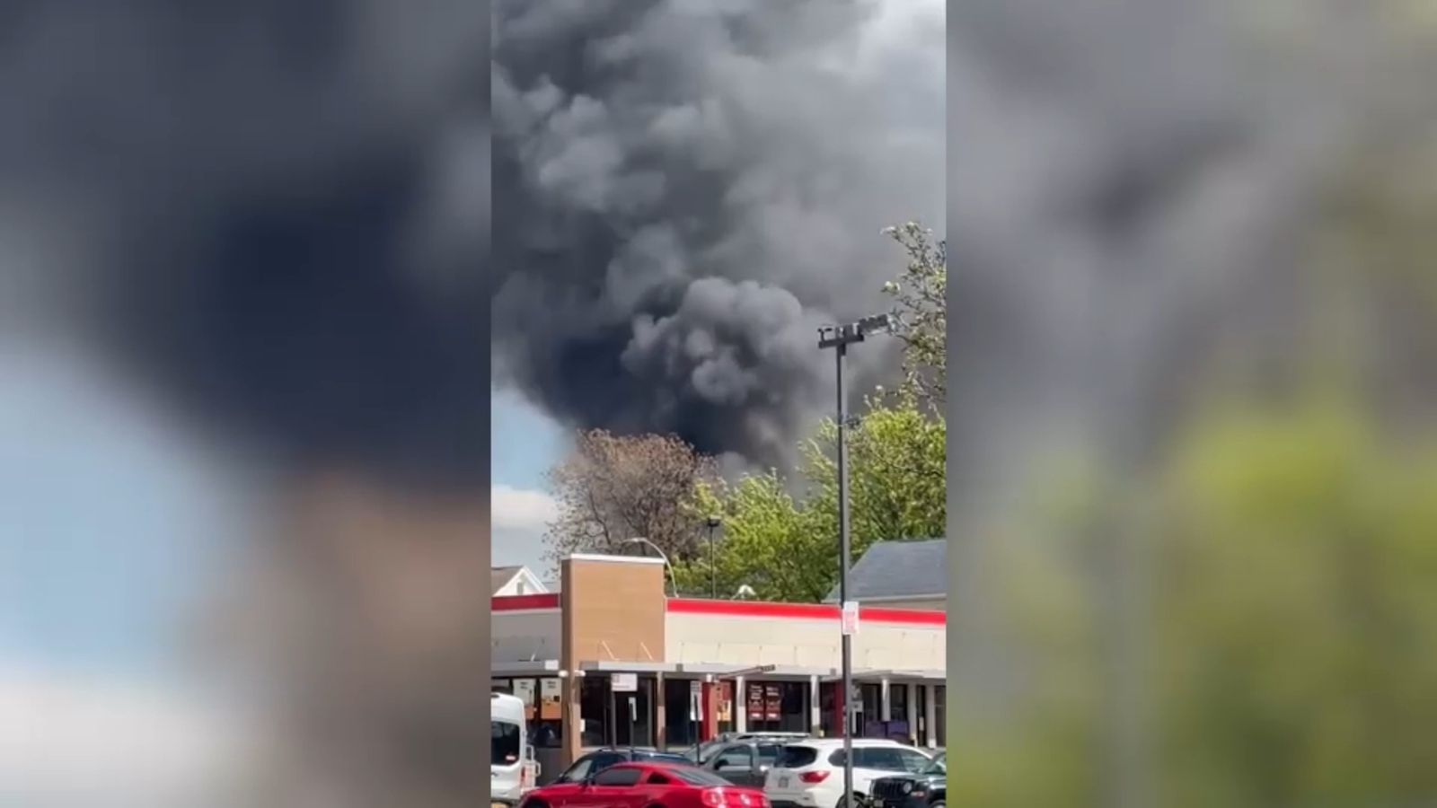 Massive fire tears through building in Queens