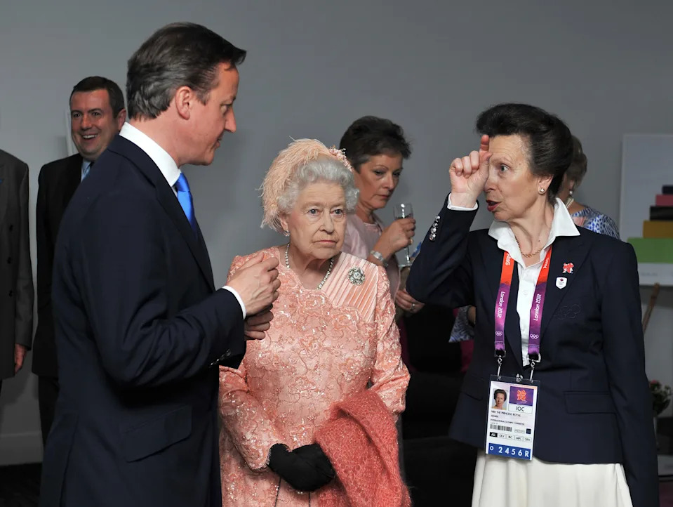 Queen Elizabeth II with the Princess Royal and Prime Minister David Cameron as they arrive for the Olympic Games 2012 Opening Ceremony at the Olympic Stadium, London.