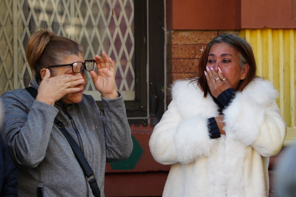 Mourners are outside the building that caught on fire in Inwood on Monday, May 4, 2026. James Keivom for NY Post