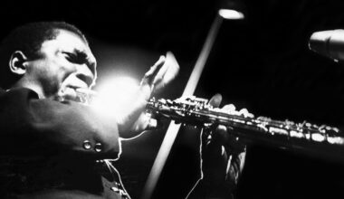 John Coltrane performs on stage at the Half Note club, New York, 1965. (Photo by Adam Ritchie/Redferns)