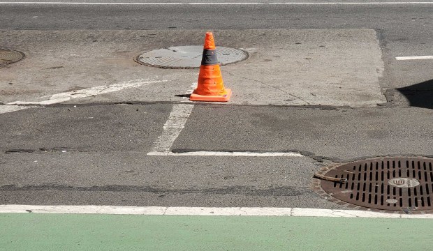 A 56-year-old woman died after falling into a manhole (top, center) in Manhattan on Monday, May 18, 2026.