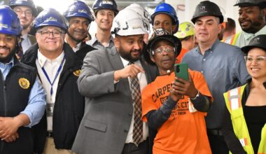 DOB Commissioner Ahmed Tigani taking a selfie with construction workers May 13 during construction safety week. Commissioner Tigani spoke with The Chief to discuss expanding worker protections under the new initiative.