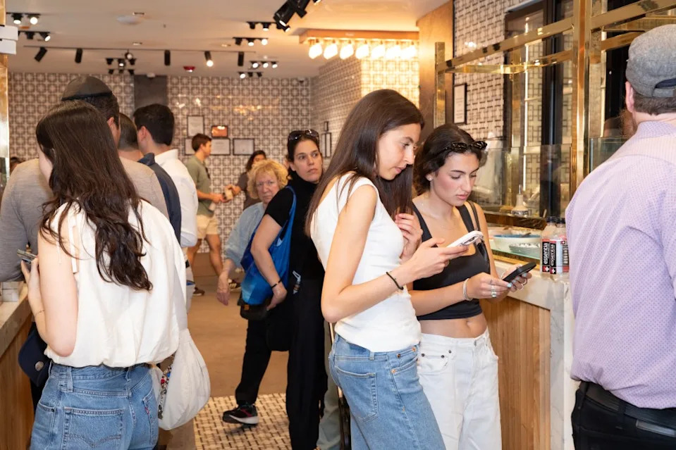Young shoppers waiting in line to order a cold drink and a sweet treat. Olga Ginzburg for the N.Y. Post
