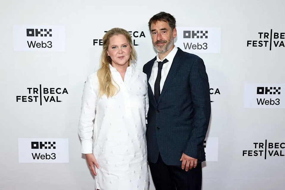Amy and her then-husband, Chris Fischer, attend the "Room To Move" premiere