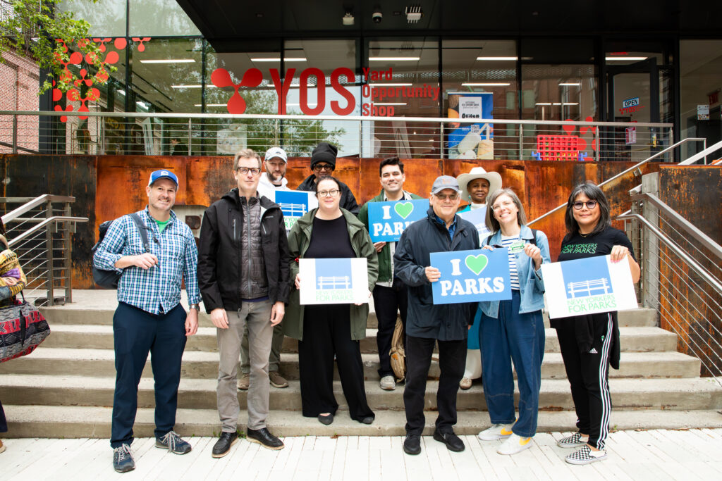 Building 92 entrance at the Brooklyn Navy Yard, left to right: Hunter Armstrong of the Brooklyn Greenway Initiative; Adam Ganser, executive director of New Yorkers for Parks; Ethan Mulligan of the Brooklyn Navy Yard; Rene Scotland, founding member of Friends of Commodore Barry Park; Rosamond Fletcher of the Fort Greene Park Conservancy; Brit Byrd, senior planner for Brooklyn Borough President Antonio Reynoso; Henry Gutman, Brooklyn Navy Yard Board chair; Emily Weidenhof, assistant commissioner for the Office of Liveable Streets; Kathy Park Price of New Yorkers For Parks. Photo: Julie Thompson/Brooklyn Eagle