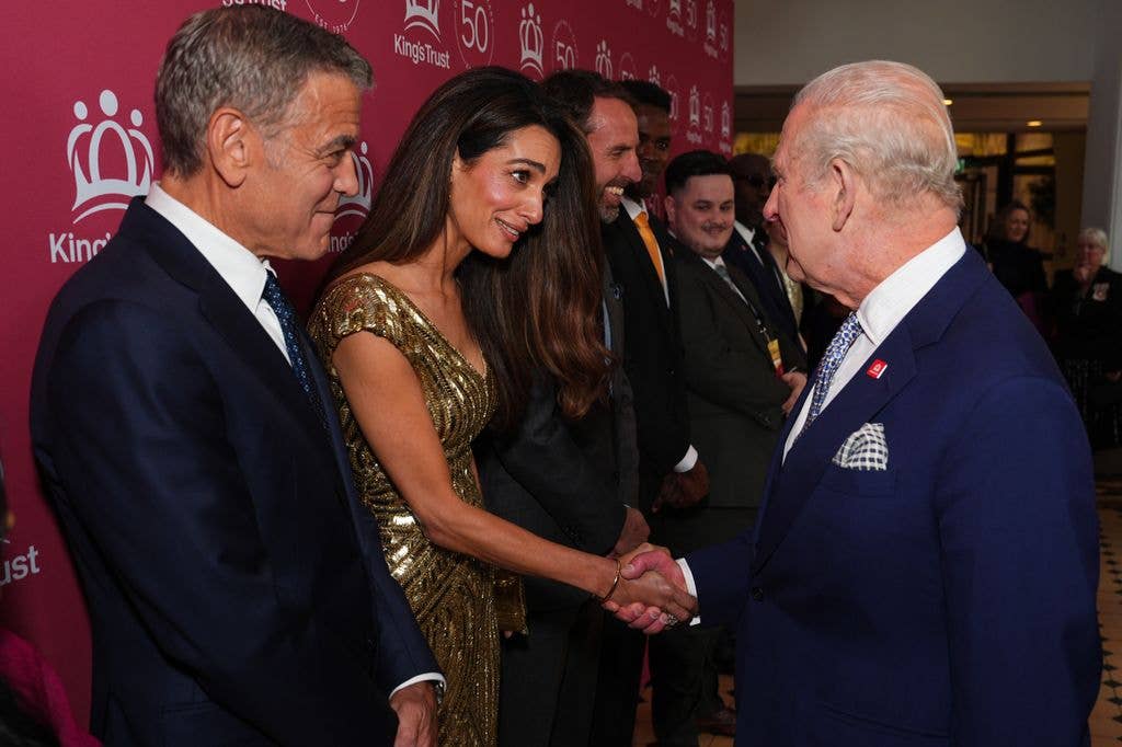 George Clooney looks on as King Charles III meets Amal Clooney