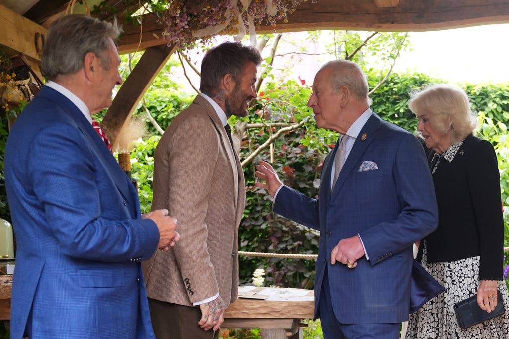 King Charles III and Queen Camilla meet Sir David Beckham (2L) as Alan Titchmarsh (L) during the press day ahead of the 2026 RHS Chelsea Flower Show at The Royal Hospital Chelsea on May 18, 2026 in London, England