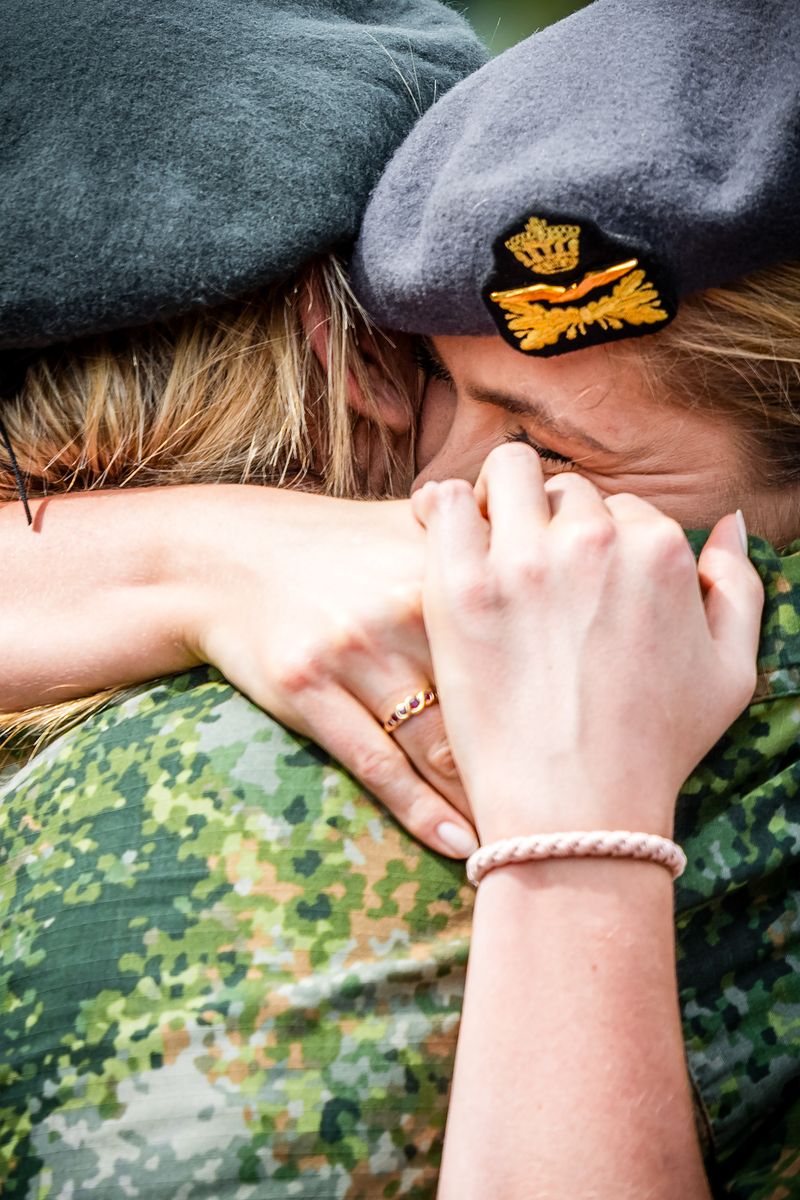 Princess Amalia becomes emotional as she embraces Queen Máxima following the monarch's military beret presentation ceremony in Breda.