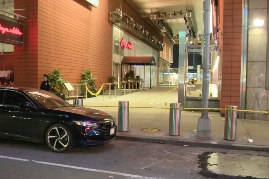 A cordoned-off crime scene outside a restaurant on West 43rd Street near Times Square, where a 39-year-old man was fatally stabbed.