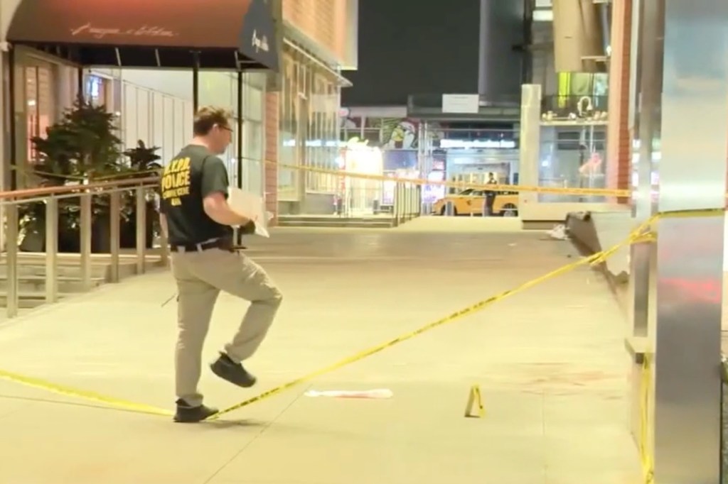 A cordoned-off crime scene outside a restaurant on West 43rd Street near Times Square, where a 39-year-old man was fatally stabbed.