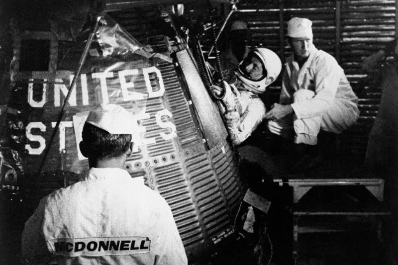 Astronaut Scott Carpenter climbs into Aurora 7 ahead of launching the second American-manned orbital flight on May 24, 1962. File Photo courtesy of NASA