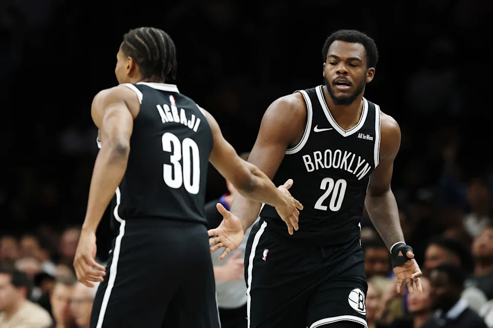 NEW YORK, NEW YORK – MARCH 09: Day'ron Sharpe #20 reacts with <a class="link " href="https://sports.yahoo.com/nba/players/6704/" data-i13n="sec:content-canvas;subsec:anchor_text;elm:context_link" data-ylk="slk:Ochai Agbaji;sec:content-canvas;subsec:anchor_text;elm:context_link;itc:0" data-yga="{"yLinkElement":"context_link","yModuleName":"content-canvas","yLinkText":"Ochai Agbaji","ySubModuleName":"anchor_text","yHasCommerce":false}">Ochai Agbaji</a> #30 of the Brooklyn Nets during the second half against the <a class="link " href="https://sports.yahoo.com/nba/teams/memphis/" data-i13n="sec:content-canvas;subsec:anchor_text;elm:context_link" data-ylk="slk:Memphis Grizzlies;sec:content-canvas;subsec:anchor_text;elm:context_link;itc:0" data-yga="{"yLinkElement":"context_link","yModuleName":"content-canvas","yLinkText":"Memphis Grizzlies","ySubModuleName":"anchor_text","yHasCommerce":false}">Memphis Grizzlies</a> at Barclays Center on March 09, 2026 in the Brooklyn borough of New York City. The Nets won 126-115. NOTE TO USER: User expressly acknowledges and agrees that, by downloading and or using this photograph, User is consenting to the terms and conditions of the Getty Images License Agreement. (Photo by Sarah Stier/Getty Images) | Getty Images