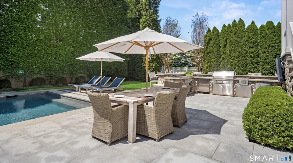 With a backyard pool and entertaining area, there's no need to spend money going out. <span class="image-credit">(Jaclyn Picarillo/Higgins Group Bedford Square)</span>
