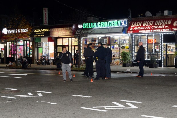 Police investigate at Burke Ave. at Barnes Ave. in the Bronx, where four people were shot in a drive-by shooting on Nov. 17, 2021.