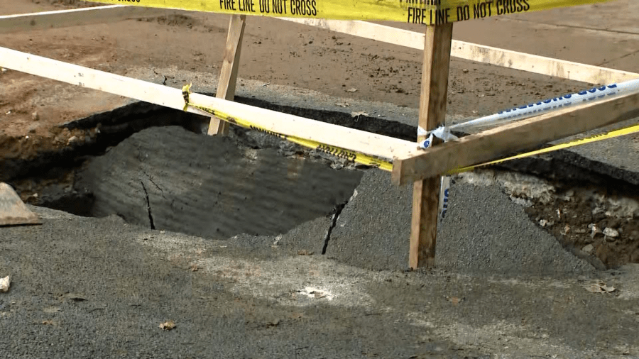 Dump truck falls into sinkhole in Brooklyn: FDNY