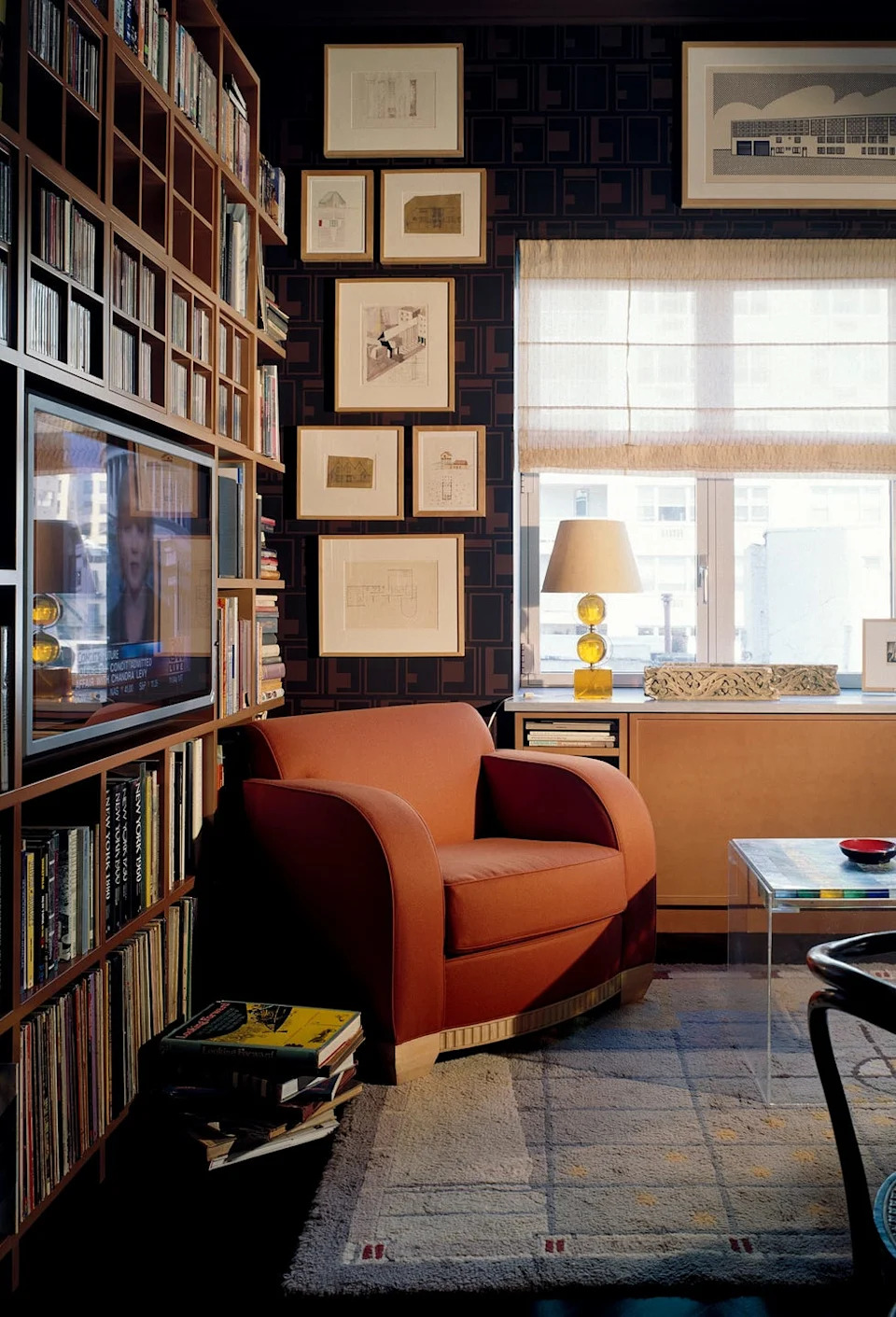 Cozy living room featuring a chair and media setup.