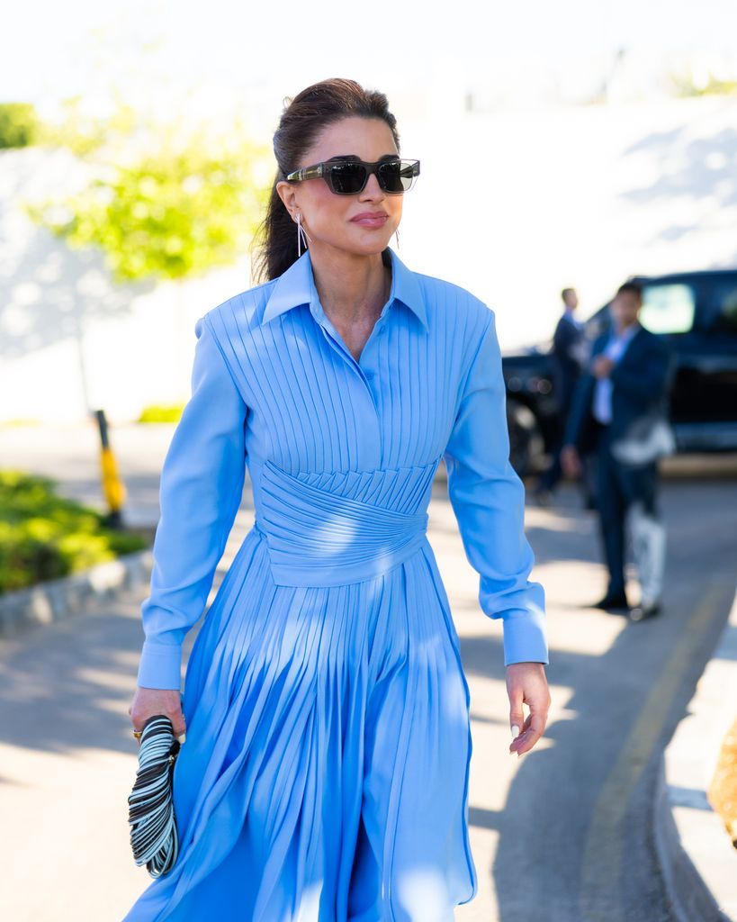 Queen Rania stepped out in Amman wearing a flowing blue pleated dress paired with rare vintage Dior heels.