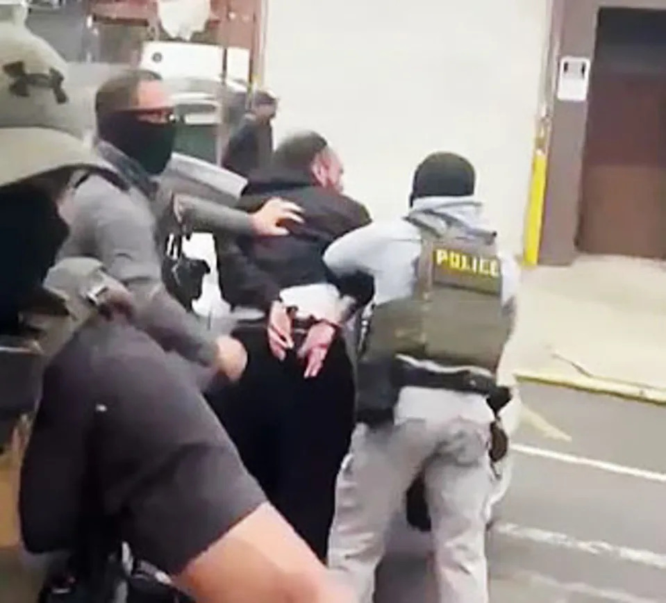 Federal agents press Jeury Concepcion against a car. (Obtained by NBC New York)