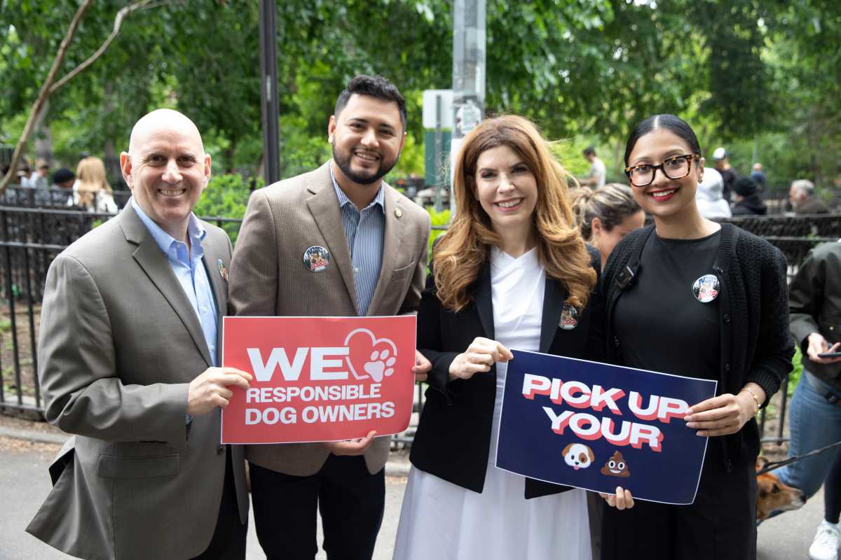 sponsors of city scoop act to combat dog waste holding signs