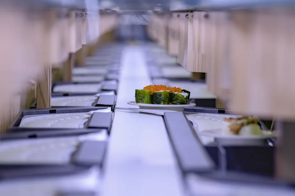 The conveyor belt goes from the kitchen through the dining room. Bloomberg via Getty Images