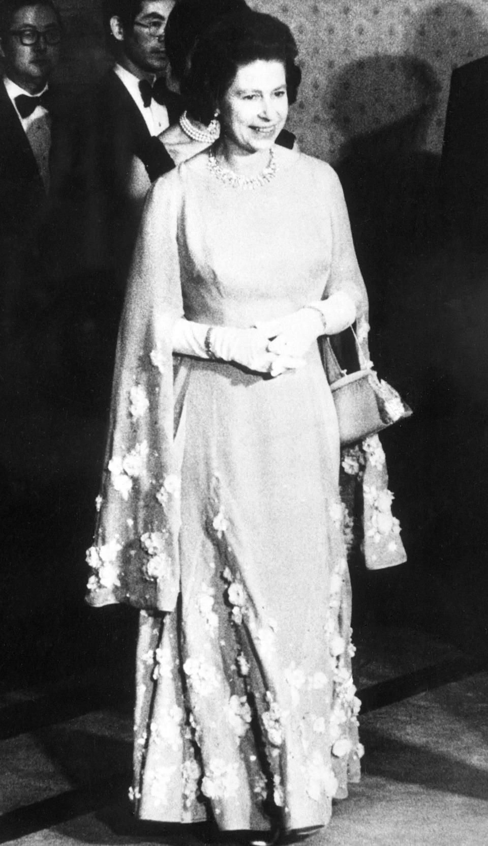 Queen Elizabeth II attending a dinner hosted by Japanese Prime Minister Takeo Miki.