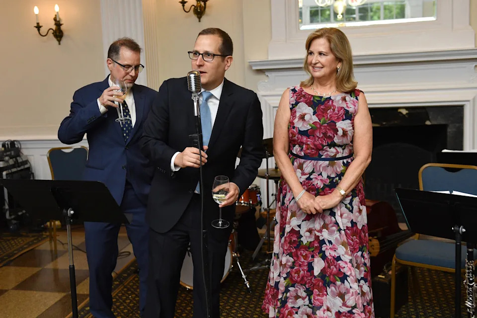 In this 2022 file photo, Micah Lasher, center, speaks at the Riverside Park Conservancy Spring Benefit in New York City alongside current city Comptroller Mark Levine, left.