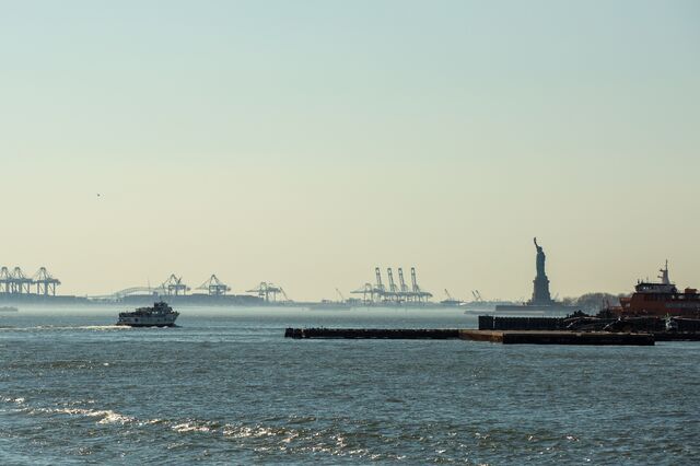 The view of a Waterway ferry with the Statue of Liberty in the distance.