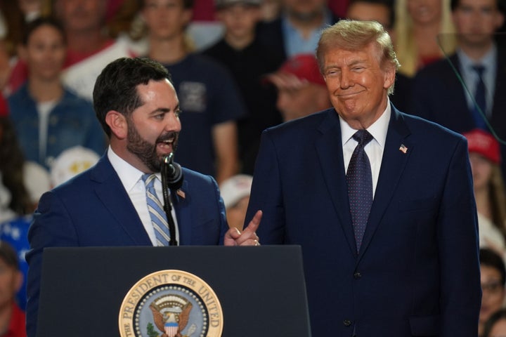 President Donald Trump listens as Rep. Mike Lawler, R-N.Y., speaks during a Fighting For American Workers event, Friday, May 22, 2026, in Suffern, N.Y. (AP Photo/Ryan Murphy)
