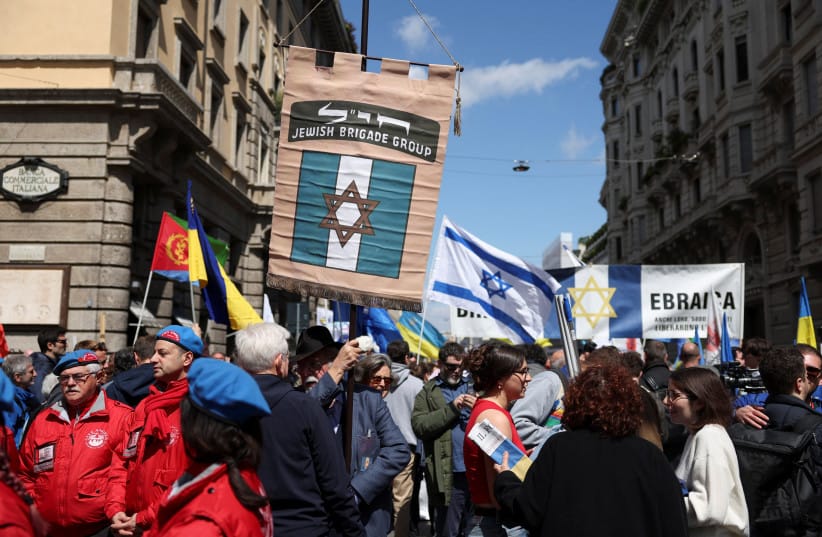 JEWISH COMMUNITY members hold Jewish Brigade sign as they participate in the 79th anniversary of the Liberation Day that commemorates the victory of the Italian resistance movement against Nazi Germany and the Italian Social Republic, in Milan, Italy, April 25, 2024.