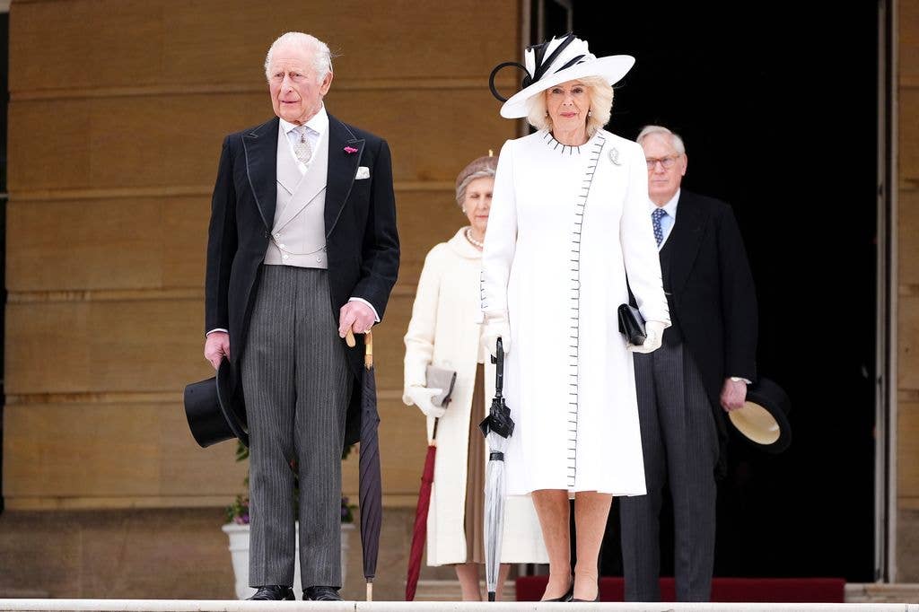 King Charles III and Queen Camilla at the garden steps before the start of a Royal Garden Party at Buckingham Palace on May 12, 2026 in London, England. The garden party celebrates frontline workers from across the United Kingdom and recognises the dedication and contribution of those who serve their communities through volunteering, supporting charitable causes and working for emergency services