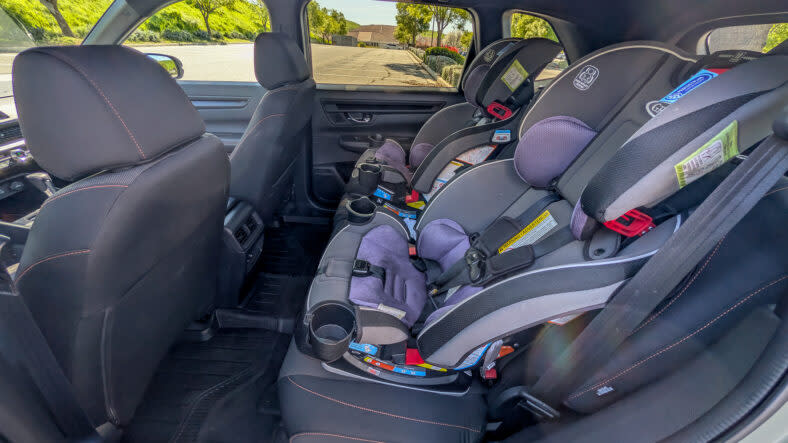 The rear seats of the 2026 Honda CR-V TrailSport, with car seats installed