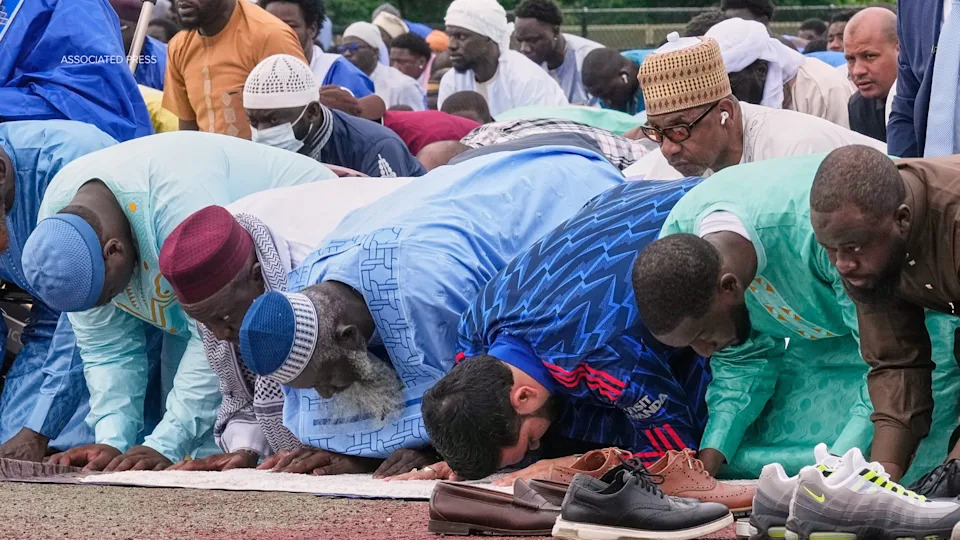 New York Mayor Zohran Mamdani, third from right, prays during an Eid al-Adha service, in the Bronx borough of New York, Wednesday, May 27, 2026. (AP Photo/Richard Drew)