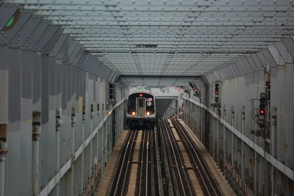 A subway train moves over the Williamsburg Bridge on March 25, 2020, in New York City.