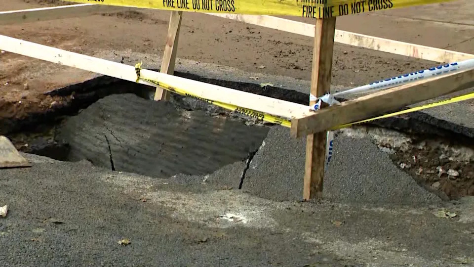 A dump truck got stuck in a pothole in Brooklyn on May 21, 2026. (Credit: PIX11 News)