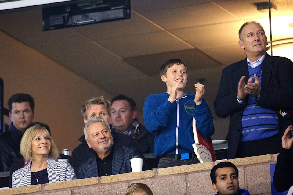 Brooklyn Beckham is pictured with his grandparents Jackie and Anthony Adams (bottom left), David Beckham's dad Ted, and others in 2011Credit: Matthew Ashton/AMA/Corbis via Getty