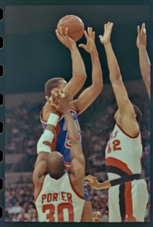 06/10/1990; Portland, Oregon, USA; Pistons'' James Edwards takes the ball to the net with Trailblazers' Wayne Cooper and Joe Craig Porter try to block the shot in the third game of the NBA Finals, Mandatory Credit: Craig Porter, Detroit Free Press, USA Today Network